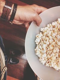 Cropped hand holding food