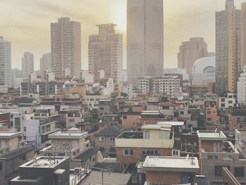 High angle view of buildings in city against sky