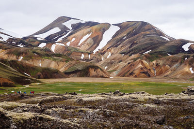 Scenic view of landscape and mountains against sky