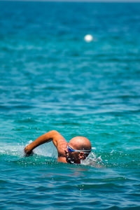 Man swimming on the sea 