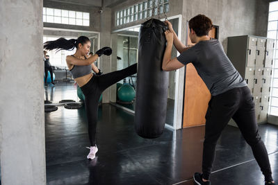 Side view of man exercising in gym