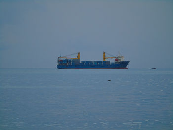 Nautical vessel on sea against clear sky