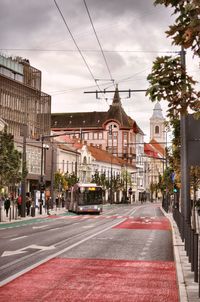 City street and buildings against sky