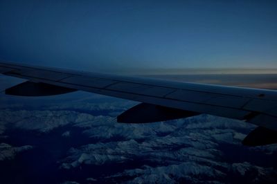 Cropped image of airplane on landscape