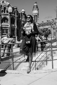 Full length of woman standing against clear sky