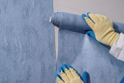 Close-up of man working on wall