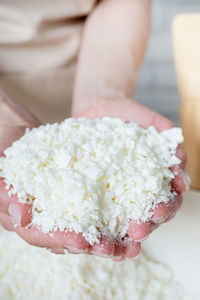 Midsection of woman holding cake