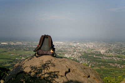 Full length of man sitting on land