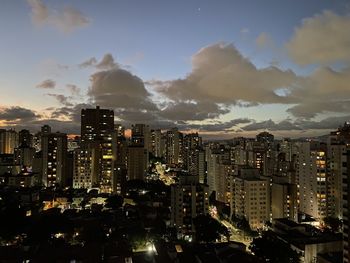 High angle view of illuminated buildings in city at night