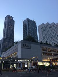 Modern buildings in city against clear sky