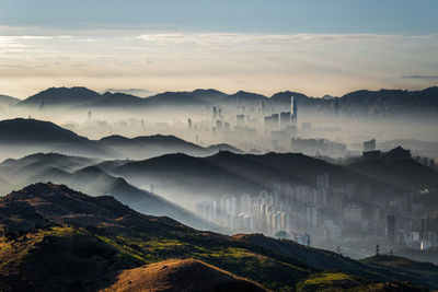 Scenic view of mountains against sky during sunrise