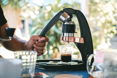 Man holding glass of coffee