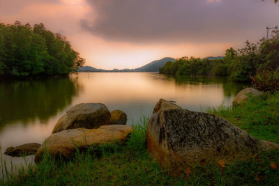 Scenic view of lake against sky during sunset