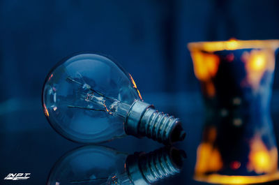 Close-up of illuminated light bulb