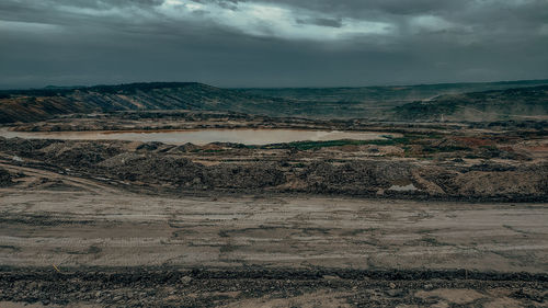 Scenic view of land against sky