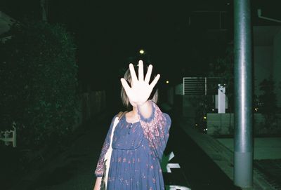 Woman standing at night