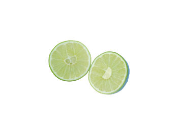 Close-up of lemon slice over white background