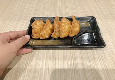 High angle view of person preparing food on table