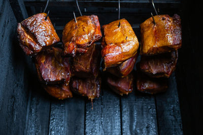 High angle view of meat on barbecue grill