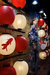 Low angle view of illuminated lanterns hanging on ceiling
