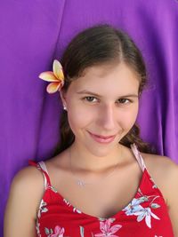 Close-up portrait of a smiling young woman