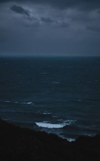 Scenic view of sea against sky at dusk