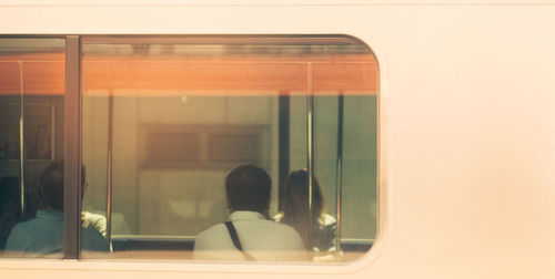 Reflection of train on glass window