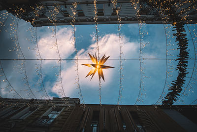 Low angle view of illuminated christmas lights