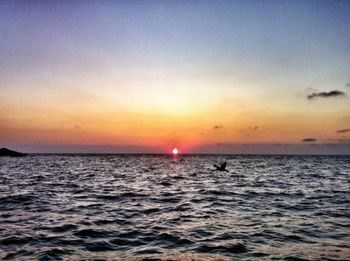 Scenic view of sea at sunset