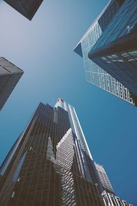 Low angle view of skyscraper against clear sky