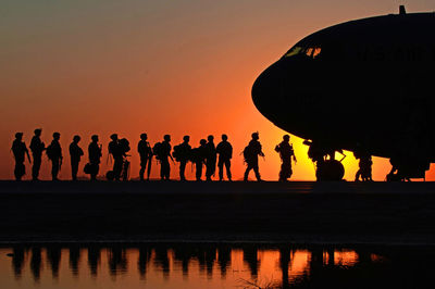 Silhouette people at sunset