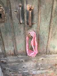 Old rusty metal door on wall