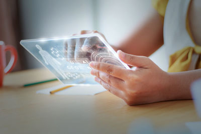 Close-up of boy using mobile phone