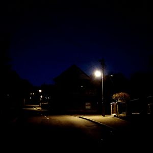 Illuminated street light at night