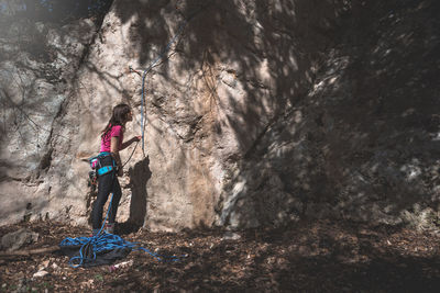 Woman preparing for rock climbing