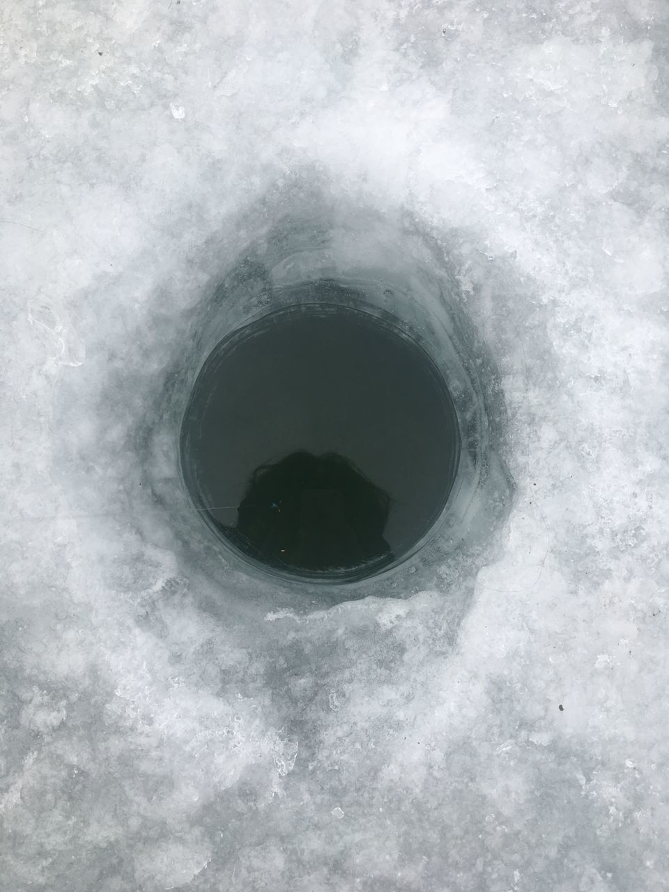 FULL FRAME SHOT OF SNOW COVERED WITH HOLE