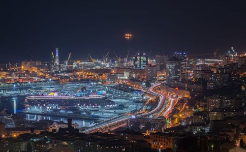 High angle view of illuminated buildings in city at night