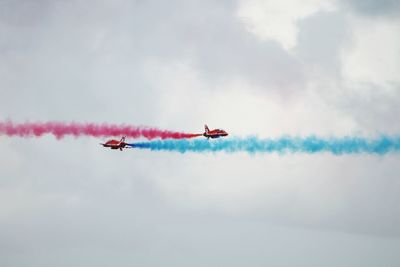 Low angle view of airplane flying in sky