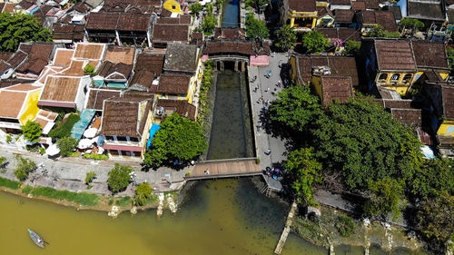 High angle view of canal by buildings in city