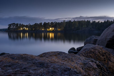 Scenic view of lake against sky during sunset