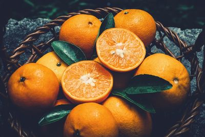 High angle view of orange fruits in basket