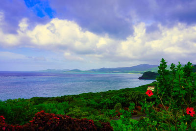 Scenic view of sea against cloudy sky