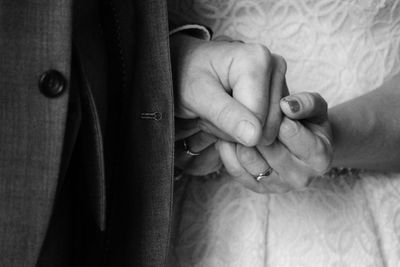 Close-up of couple holding hands