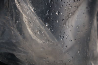 Full frame shot of wet glass window