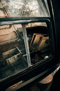 Close-up of abandoned car window