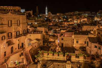 High angle view of illuminated buildings in city at night