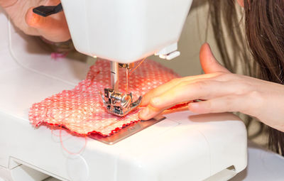 Midsection of woman working in tray