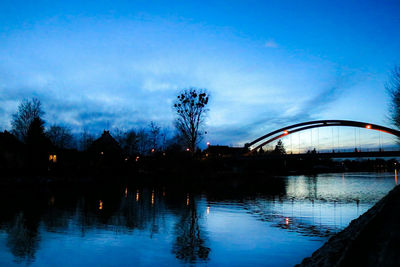 Bridge over river with buildings in background