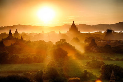 Panoramic view of pagoda against sky during sunset