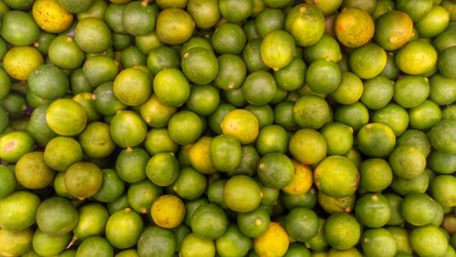 Full frame shot of limes at market stall